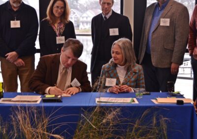 Ken Kimball of the Elizabeth River Project signs the nation’s first rolling conservation easement in Norfolk Jan. 16, 2024. Photo by Jim Morrison