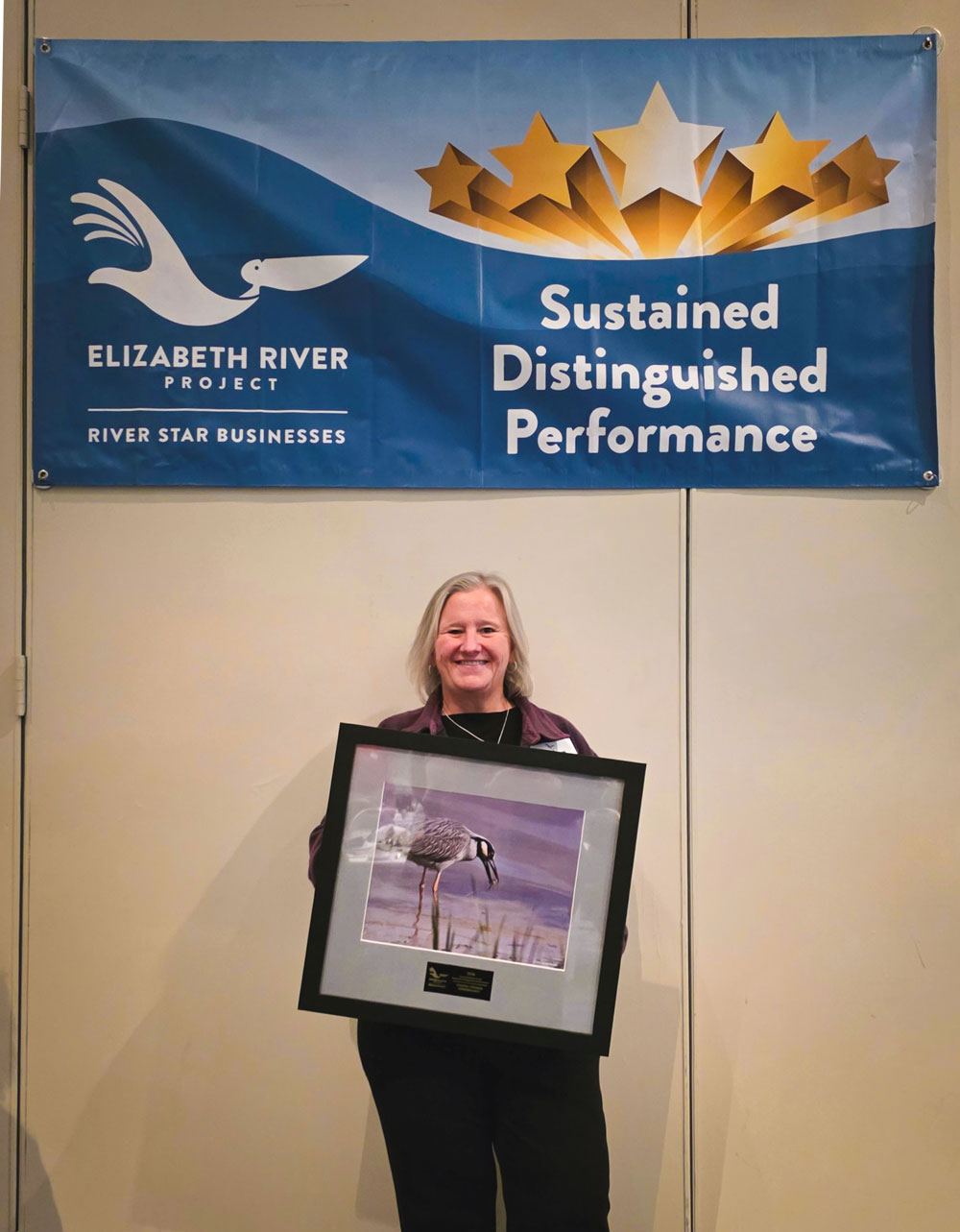 CoVa Conserve Executive Director Helen Kuhns accepts River Star Business award